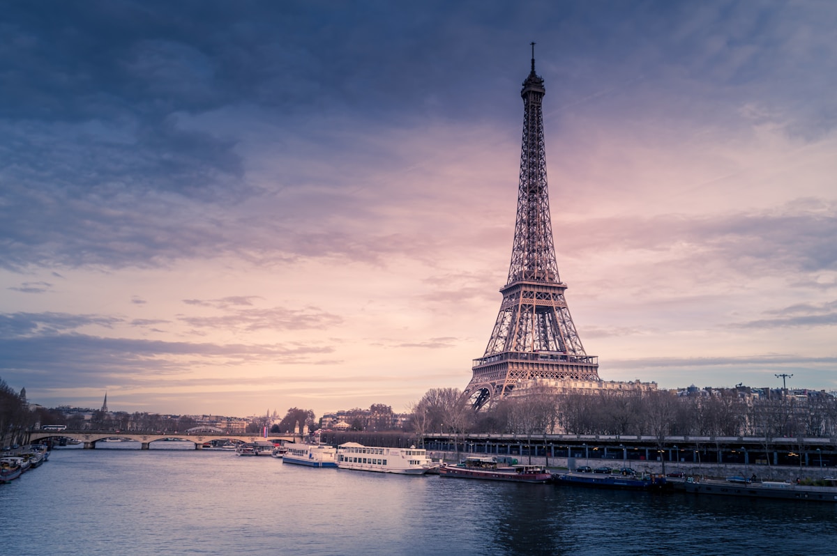 Family visiting Eiffel Tower Paris with children